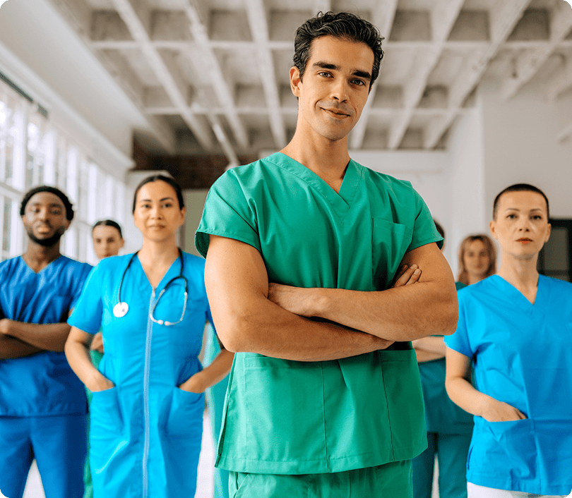 Medical team in scrubs standing confidently